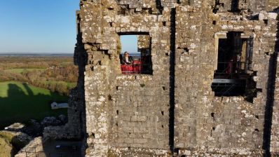 Visitor_at_the_window_of_the_Kings_view_platform_at_Corfe_Castle.__Image._National_Trust._Richard_Gregory_-_Copy-min.jpg